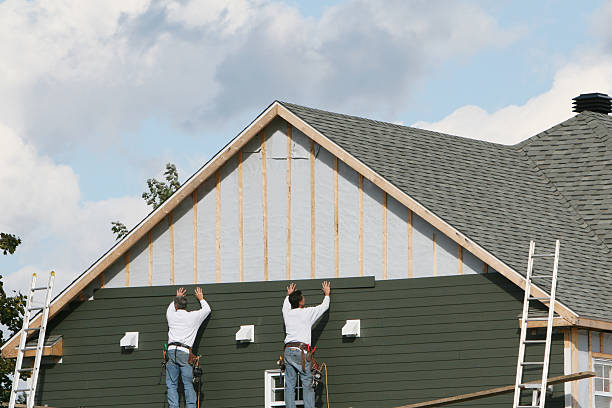 Professional Siding technician working in Karthaus, PA